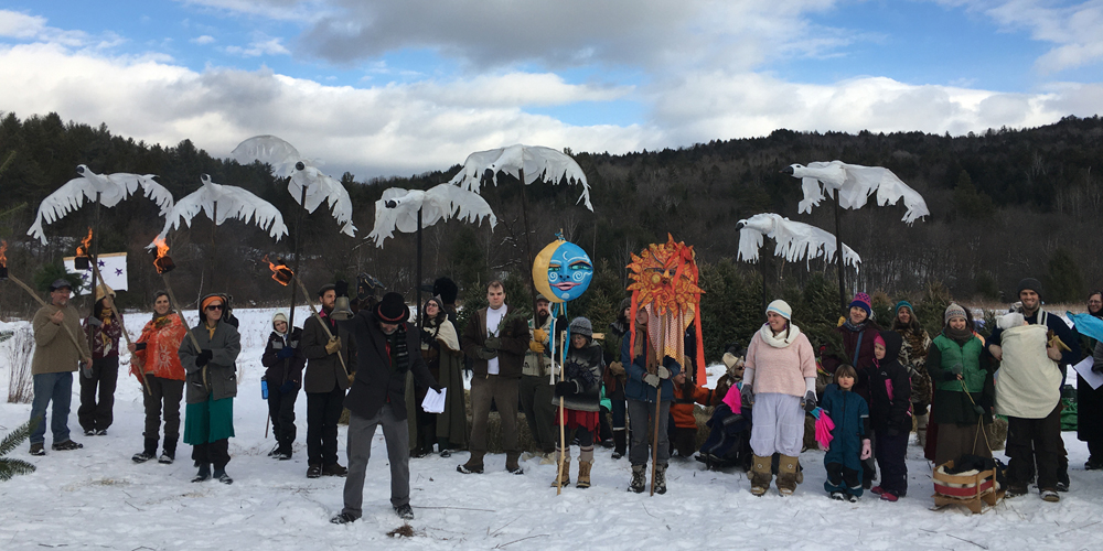 people holding puppets in snow