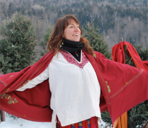Woman with red shawl singing in snow