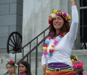 Woman with brown hair, flower crown at the statehouse